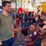 João Drumond em ação social do Instituto Imperatriz Leopoldinense na Favela Nova Brasília, no Complexo do Alemão: neto de Luizinho Drumond está em pré-campanha para deputado estadual
