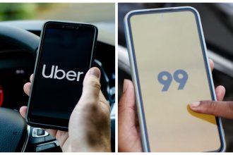 Logos das empresas de transporte por aplicativo Uber e 99 em celulares