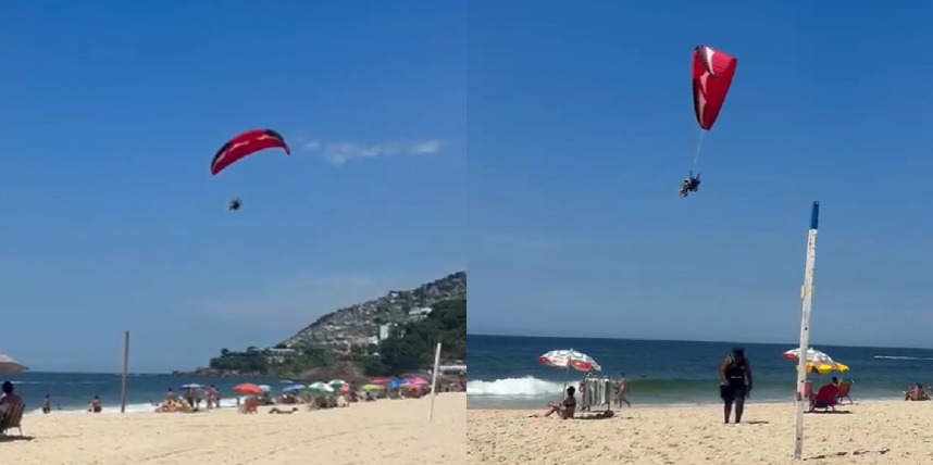 Homem sobrevoa banhistas de parapente em Ipanema