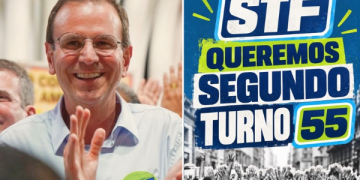 Eduardo Paes e banner de campanha por segundo turno